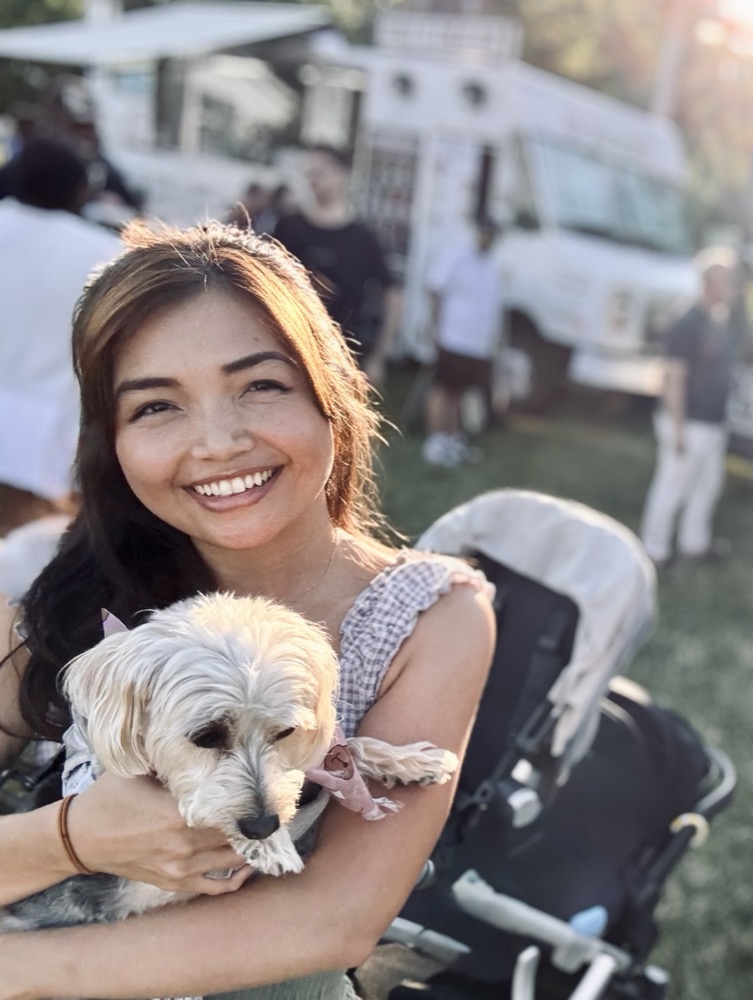 Holly holding Bella at a food festival